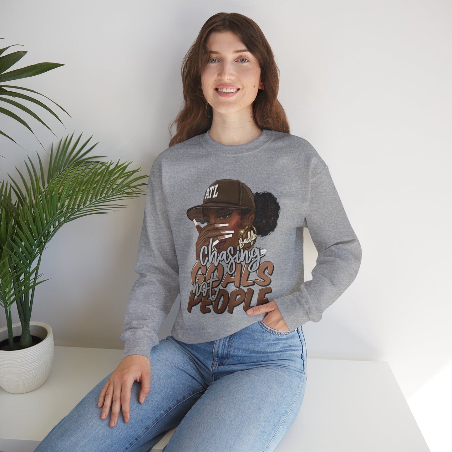 Crewneck Sweatshirt — "Chasing Goals Not People" Graphic (Girl with Cap)
