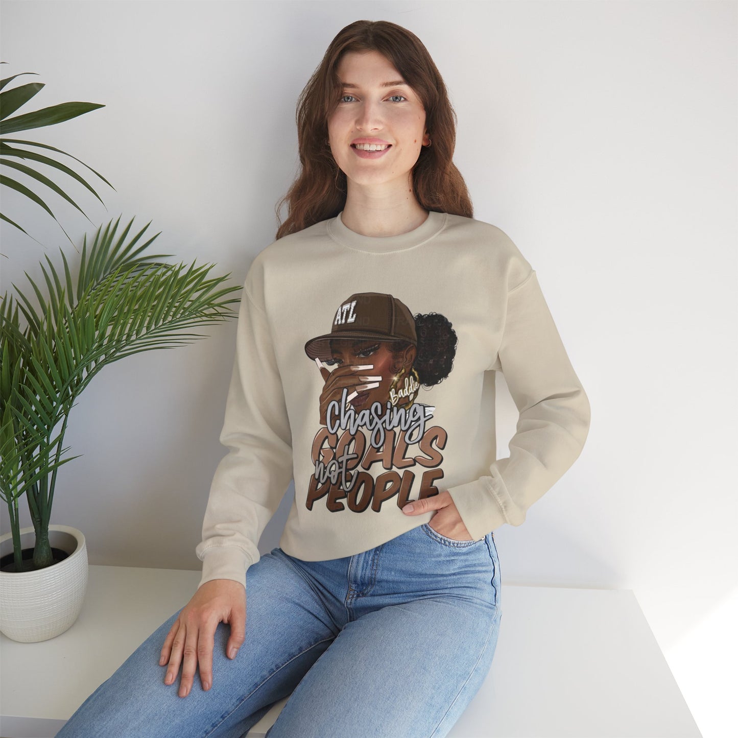 Crewneck Sweatshirt — "Chasing Goals Not People" Graphic (Girl with Cap)